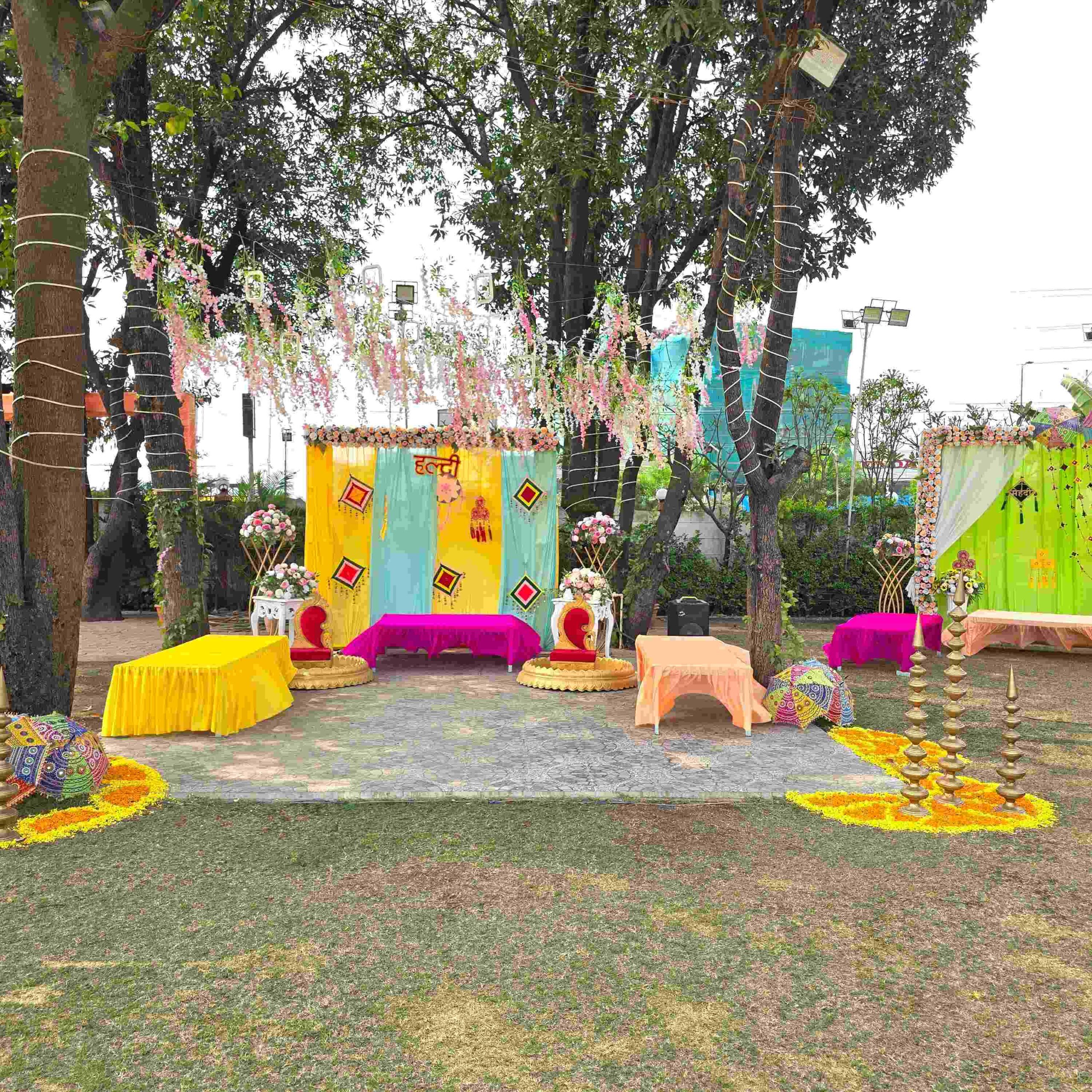Outdoor Haldi decoration under mango trees at Utsav Marriage Garden Bhopal